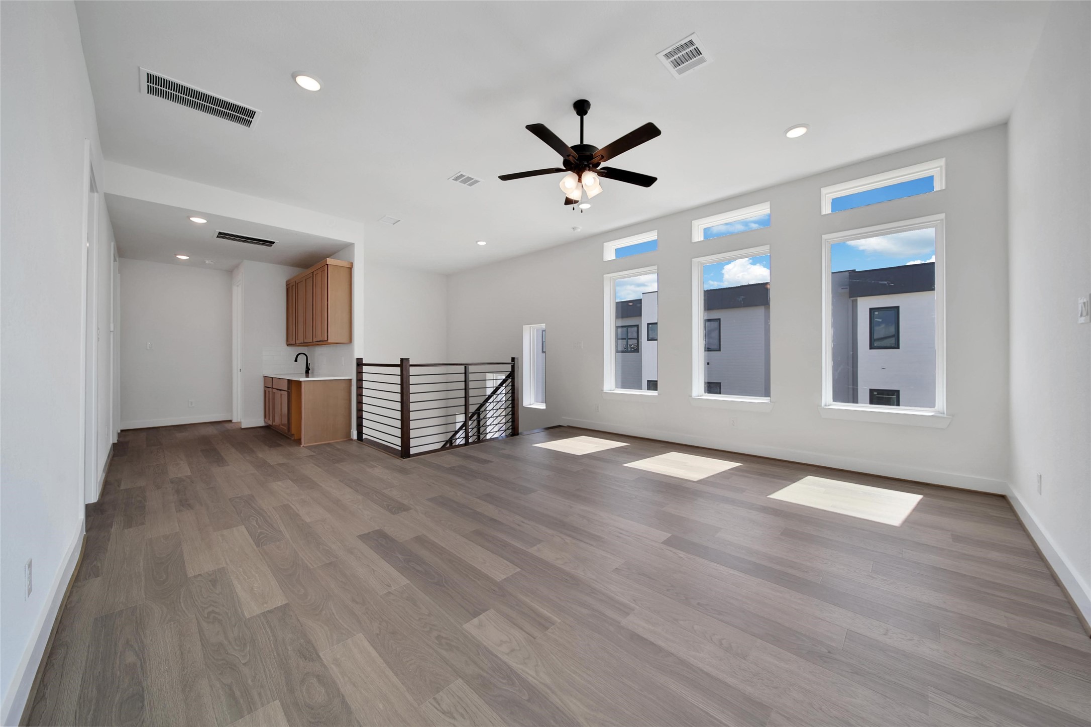 4404 Anthony Court Lane Seabrook, TX 77586 - Photo 15 of 36 a view of a livingroom with a hardwood floor and a ceiling fan