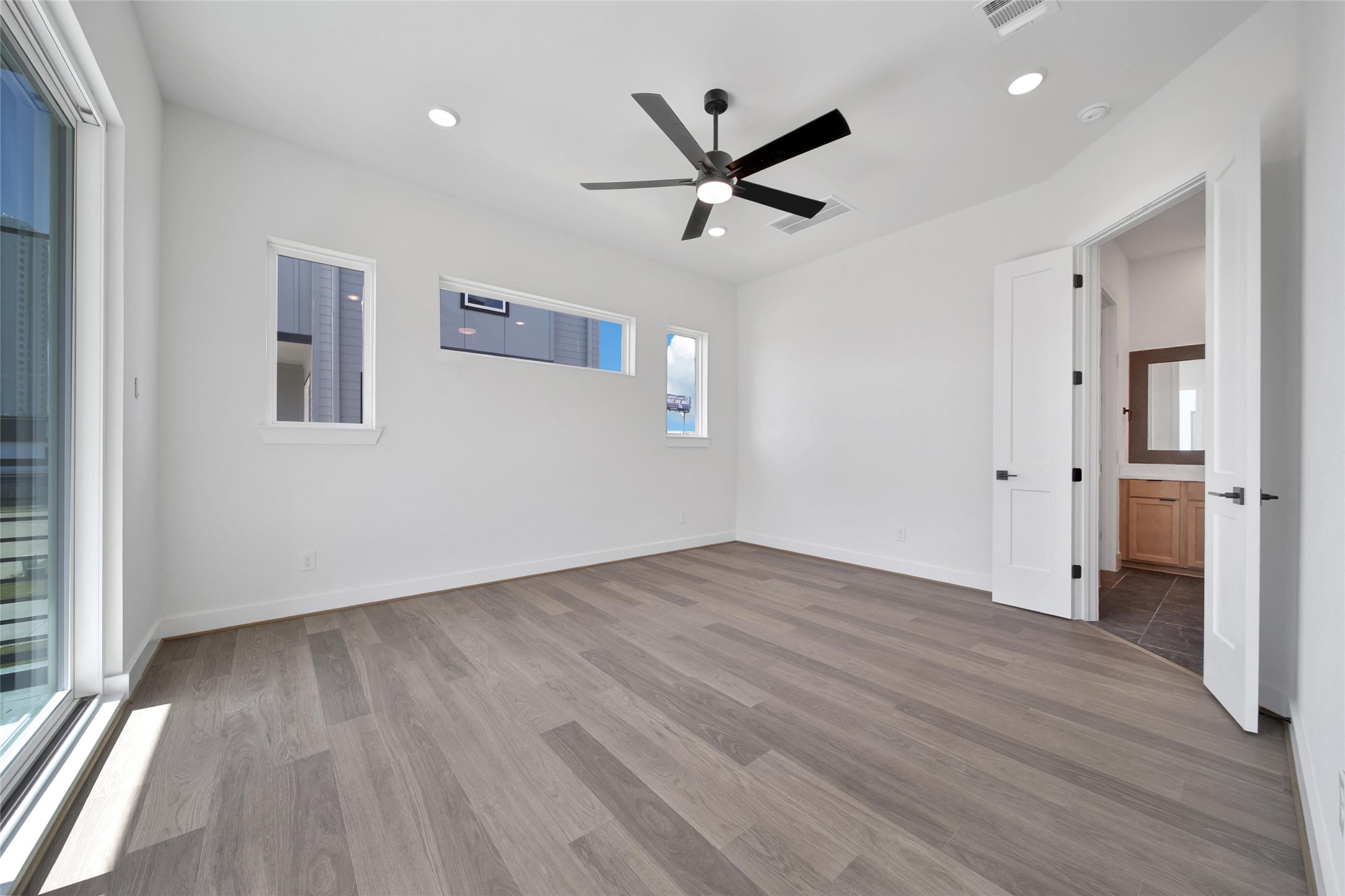 4404 Anthony Court Lane Seabrook, TX 77586 - Photo 10 of 36 wooden floor in an empty room with a window