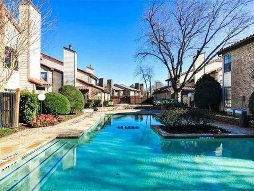 5626 Preston Oaks Road, Unit 39C Dallas, TX 75254 - Photo 12 of 38 Community pool featuring a patio area and a residential view