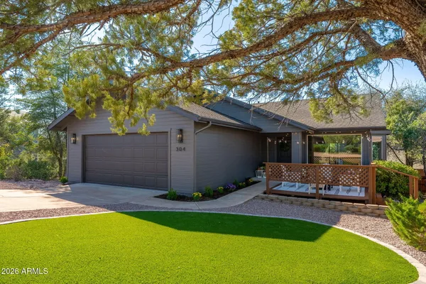 a front view of house with yard and outdoor seating