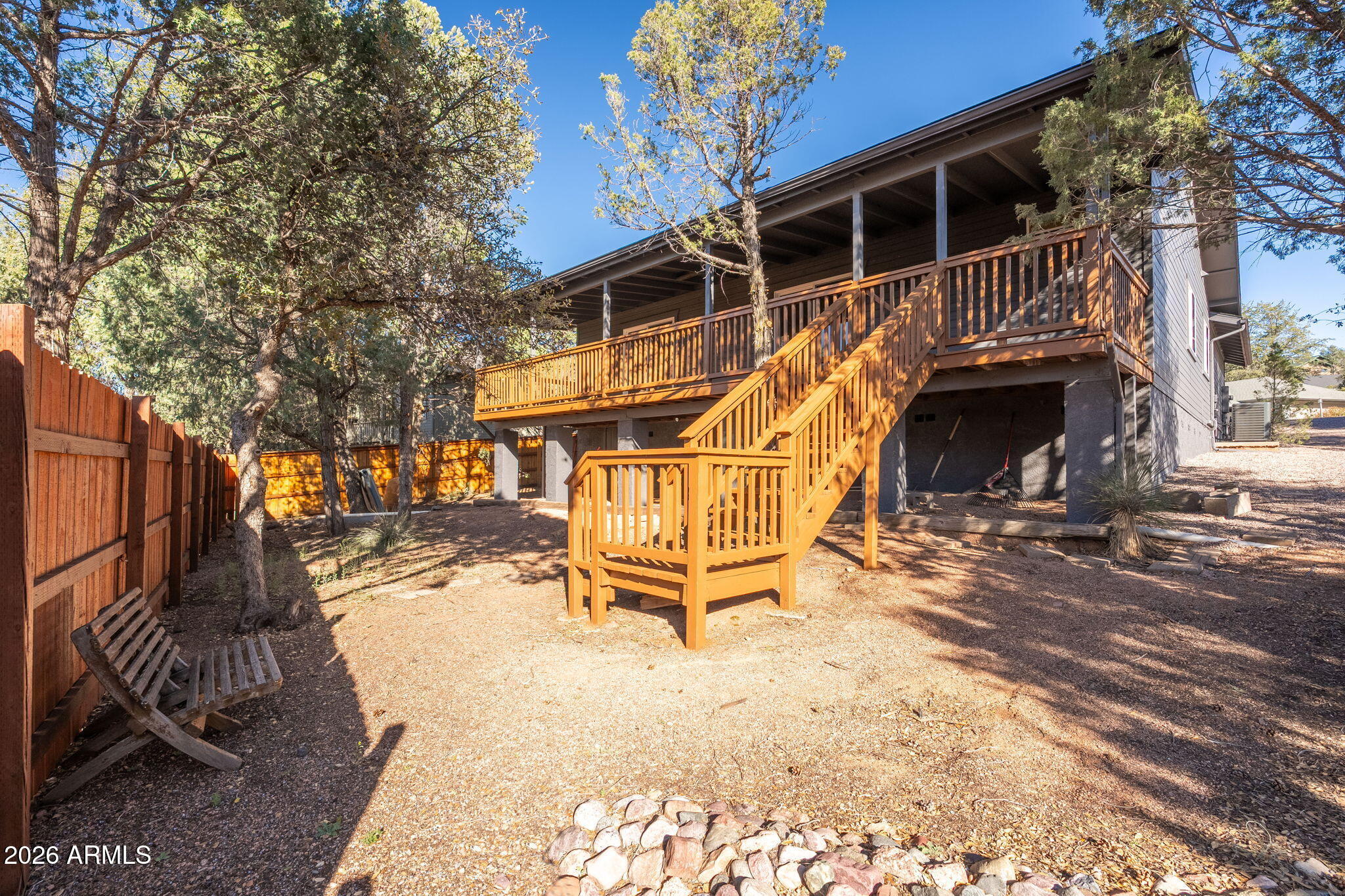 304 North Trailwood Road Payson, AZ 85541 - Photo 12 of 12 a view of a roof deck with table and chairs with wooden fence