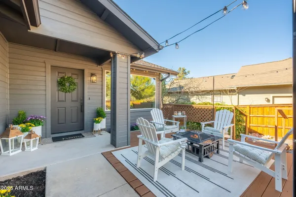 a view of an outdoor dining space with a patio