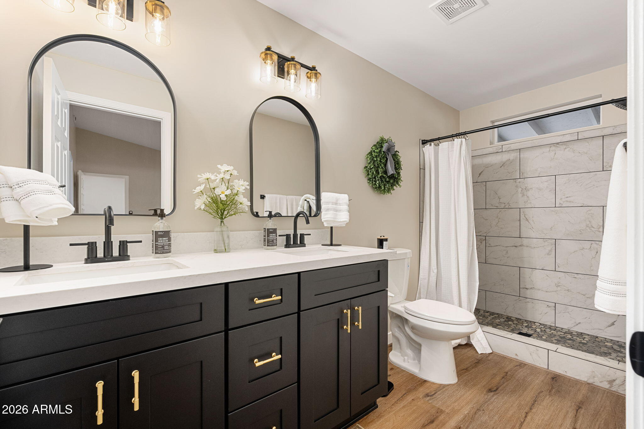 304 North Trailwood Road Payson, AZ 85541 - Photo 9 of 12 a bathroom with a double vanity sink a toilet and a mirror