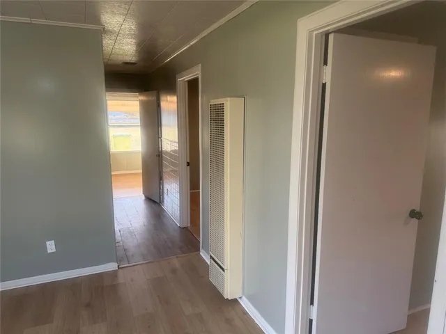 a view of entryway with wooden floor