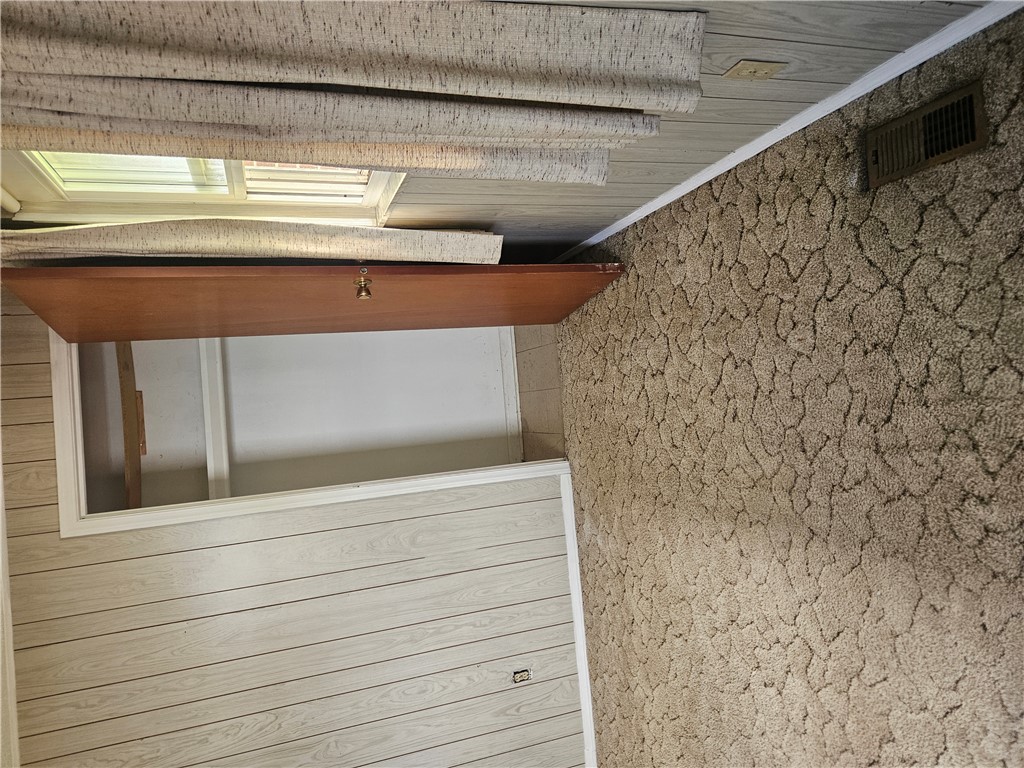 6510 Longford Road Dayton, OH 45424 - Photo 27 of 27 This cozy room offers comfortable carpeting and a spacious walk-in closet for ample storage.