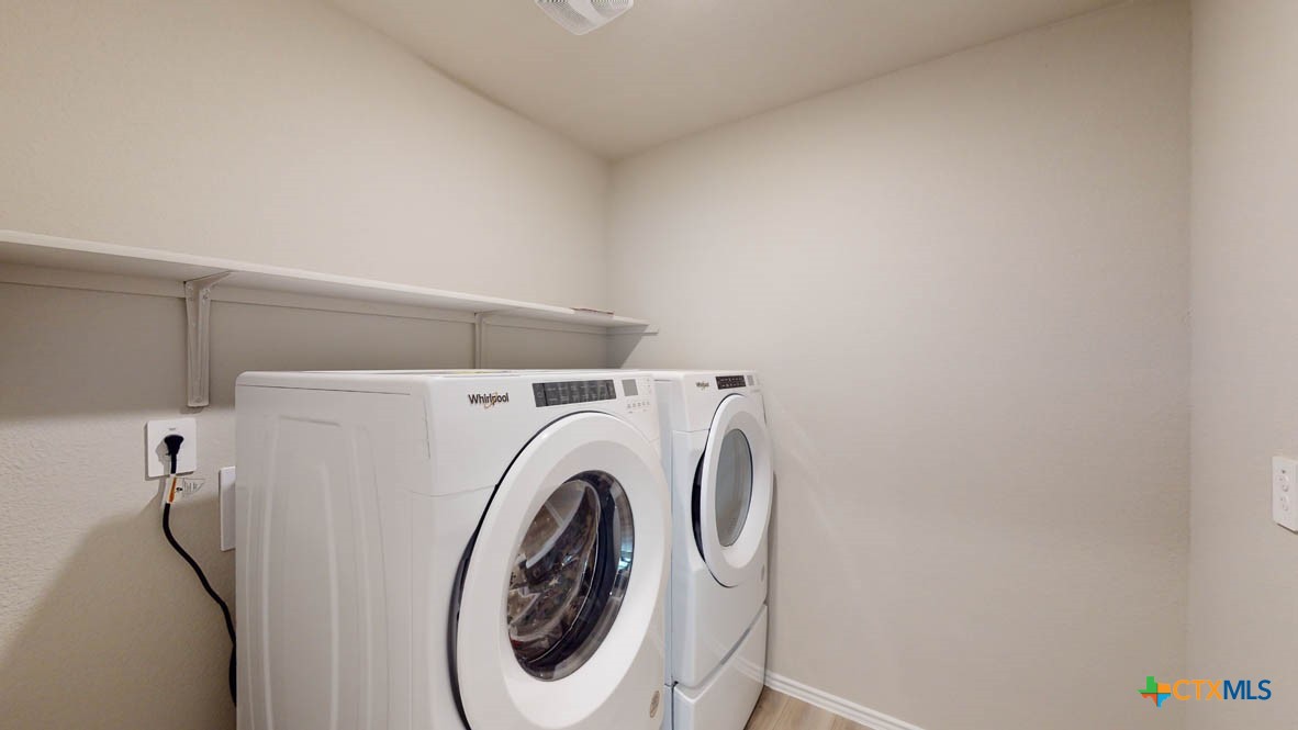 1310 Merritt Road Temple, TX 76504 - Photo 28 of 28 a utility room with dryer and washer