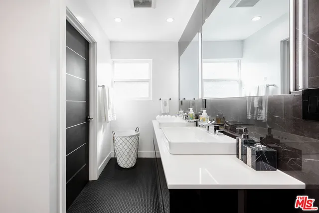 a kitchen view with a sink stainless steel appliances and cabinets