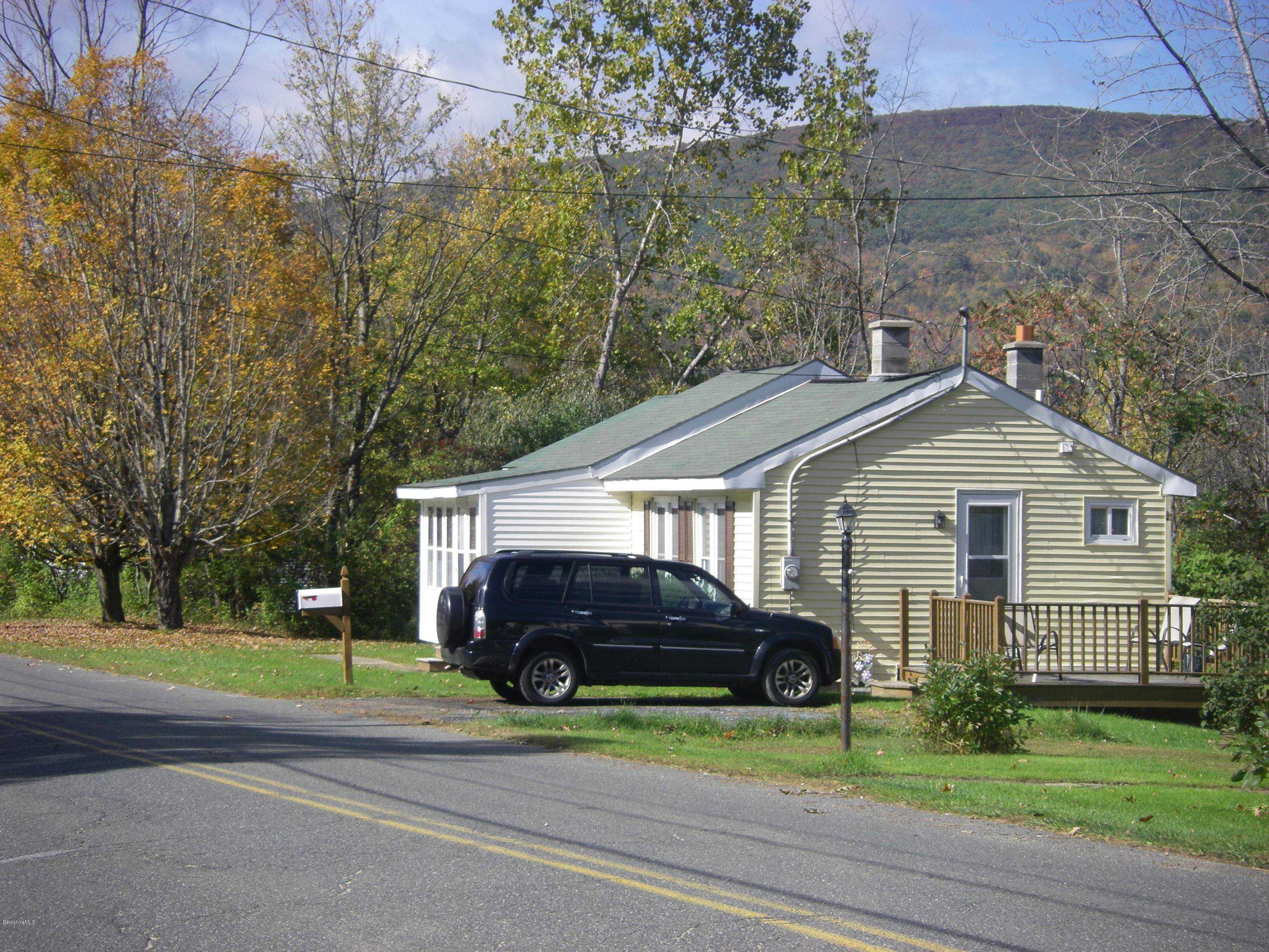 300 Cross Road Clarksburg, MA 01247 - Photo 2 of 29 a car parked in front of a house