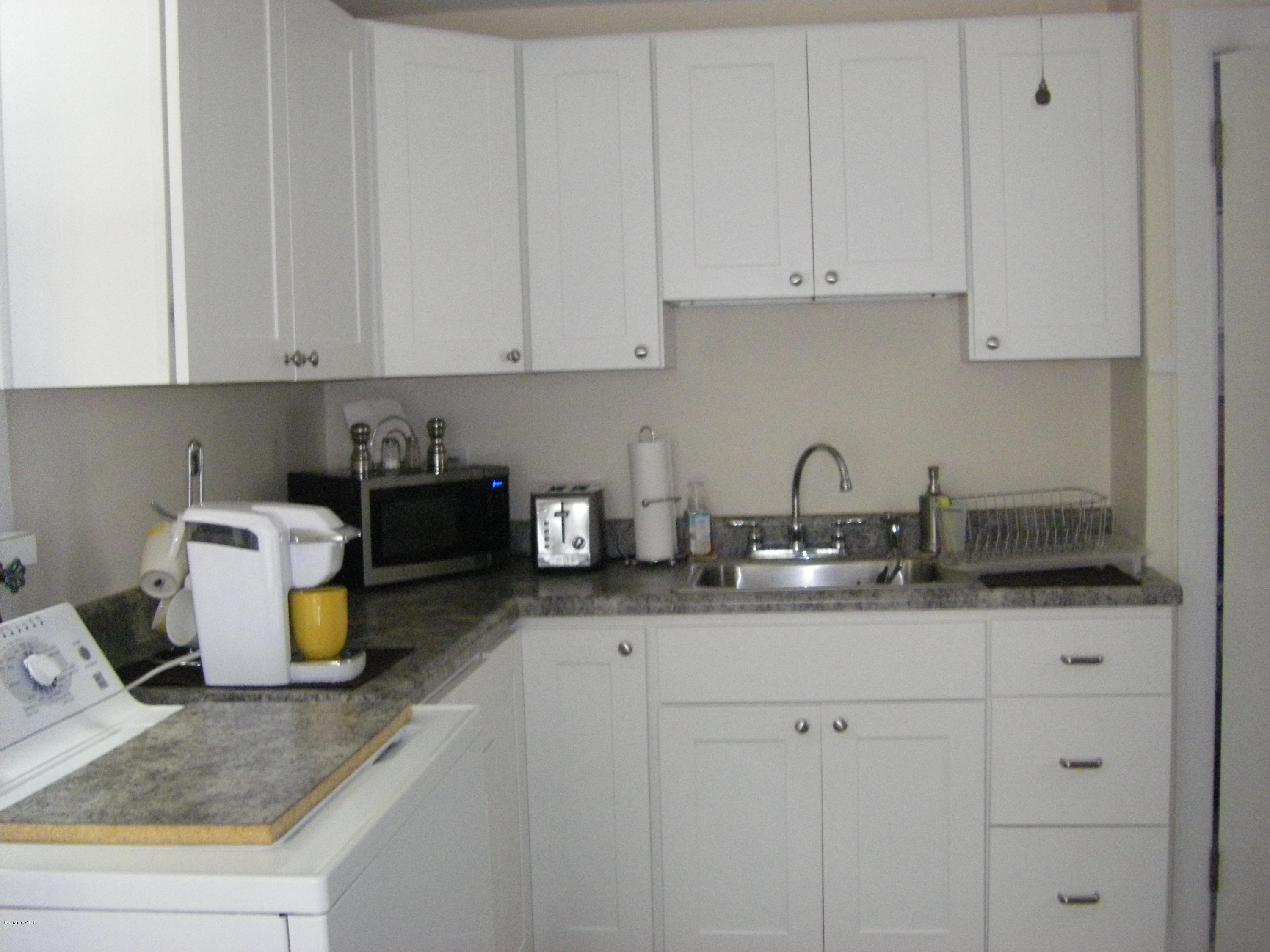 300 Cross Road Clarksburg, MA 01247 - Photo 13 of 29 a kitchen with a sink and cabinets