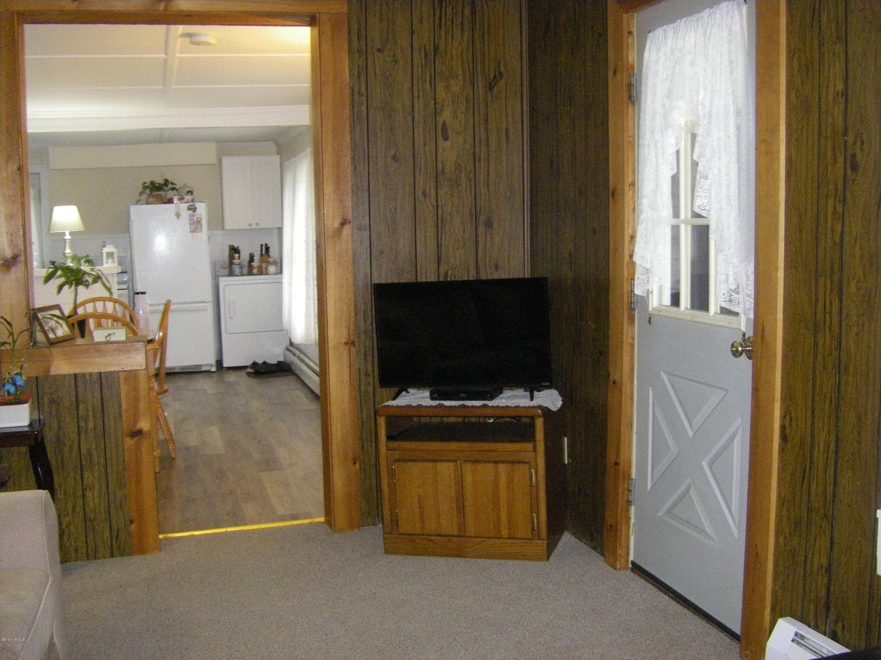 300 Cross Road Clarksburg, MA 01247 - Photo 19 of 29 a living room with furniture and a flat screen tv