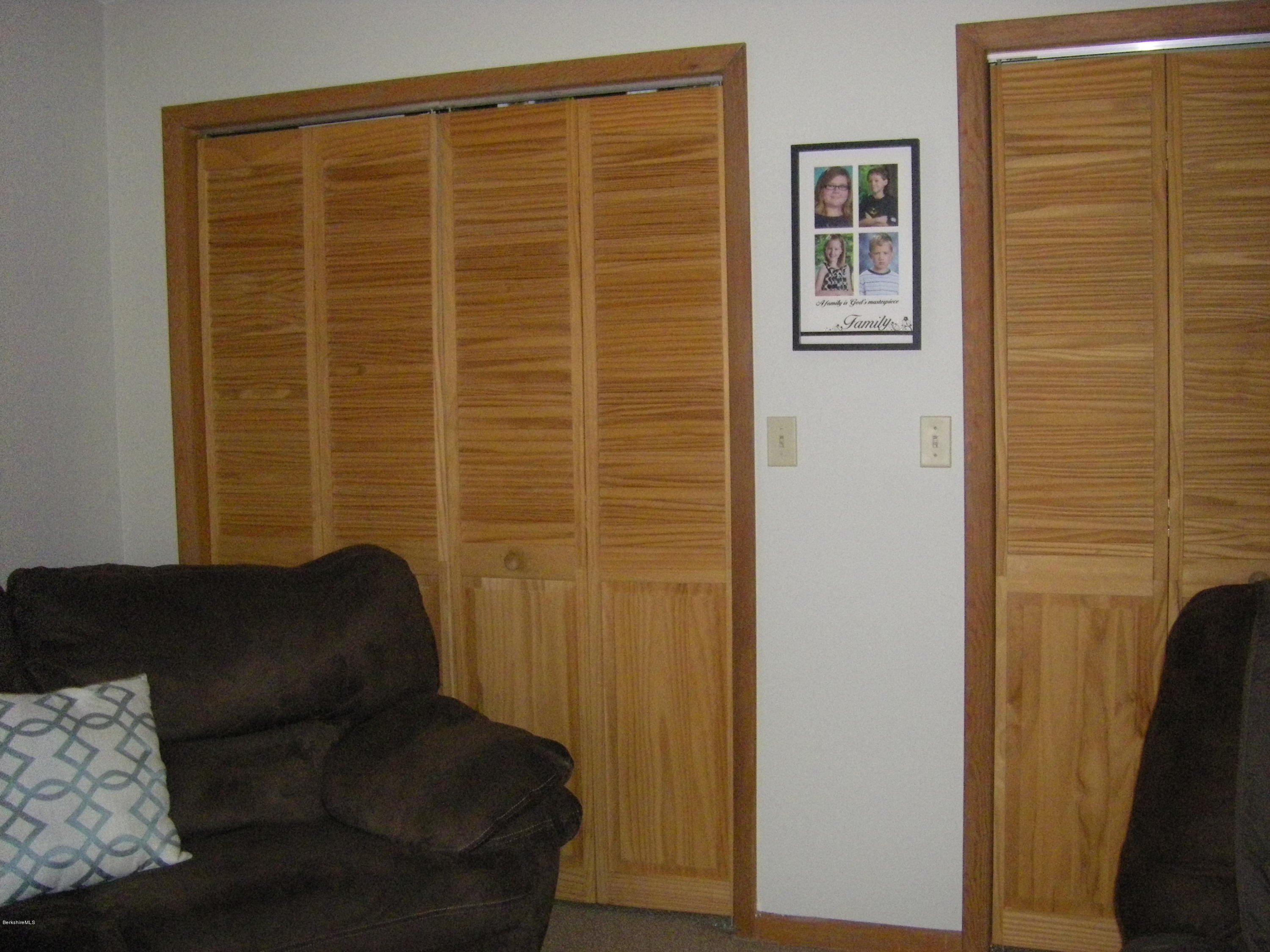 300 Cross Road Clarksburg, MA 01247 - Photo 26 of 29 a living room with a couch and a door