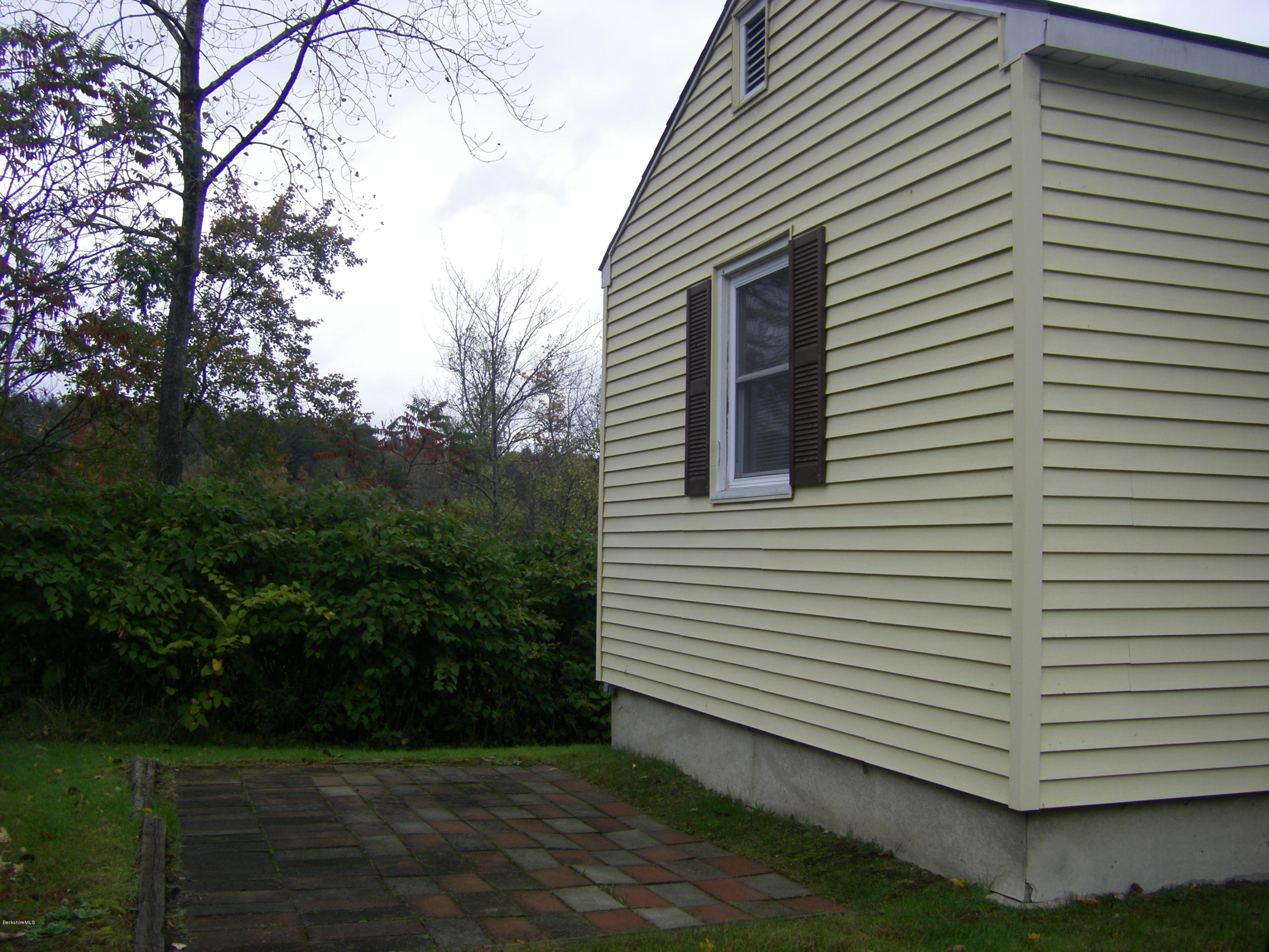 300 Cross Road Clarksburg, MA 01247 - Photo 5 of 29 a view of a white house next to a yard