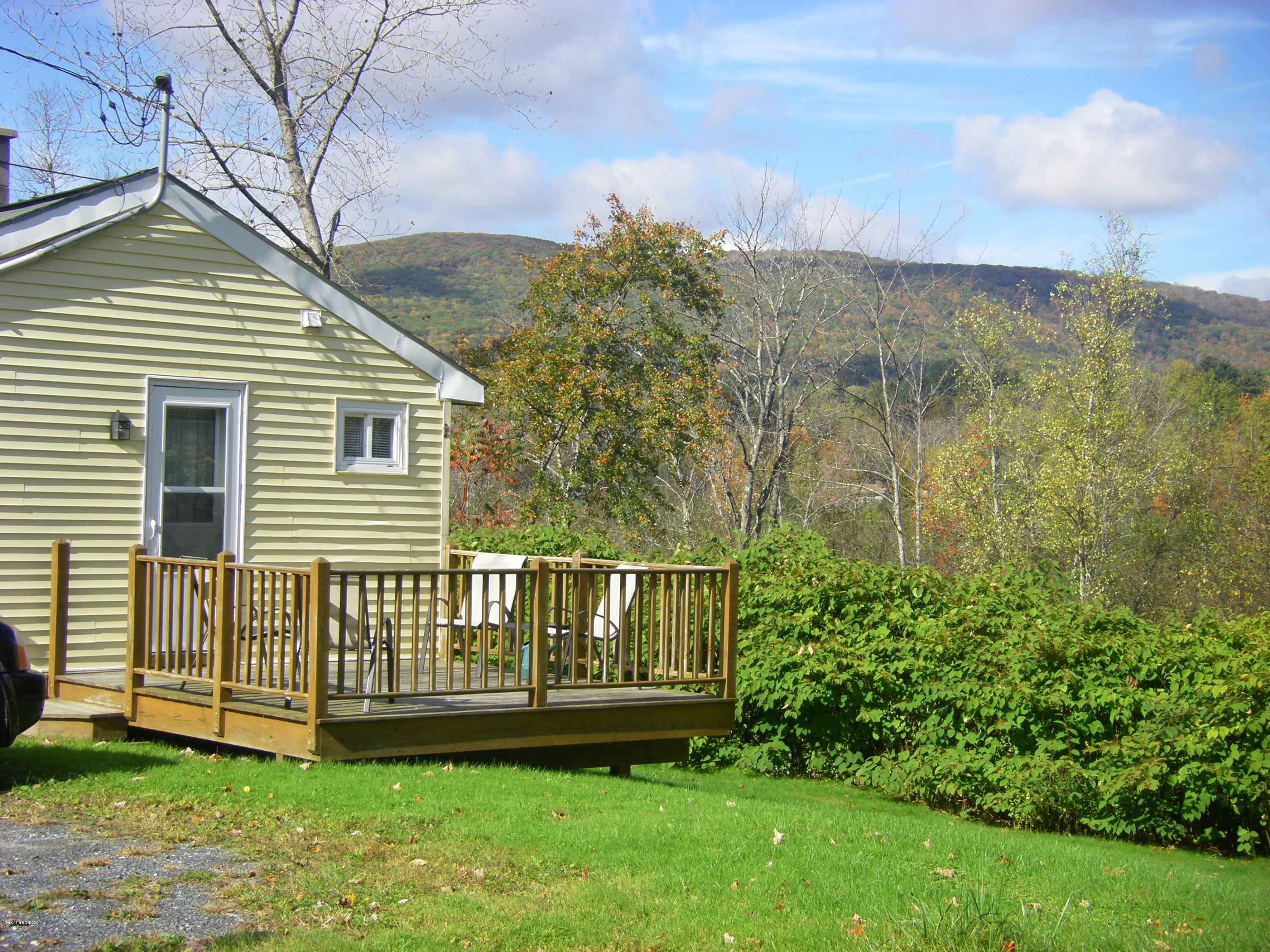 300 Cross Road Clarksburg, MA 01247 - Photo 6 of 29 a view of a house with a yard and a garden