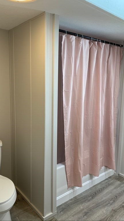 194 Lafayette Road Salisbury, MA 01952 - Photo 7 of 9 a bathroom with a shower curtain and toilet