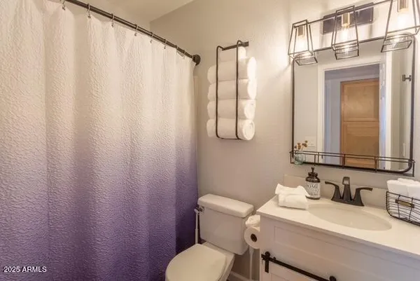 a bedroom with a bed and a table in it