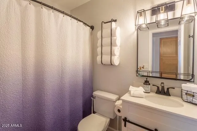 a bedroom with a bed and a table in it