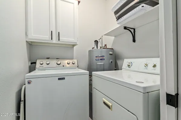 a kitchen with stainless steel appliances granite countertop a refrigerator and a stove