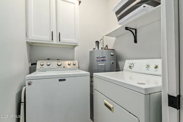 a kitchen with stainless steel appliances granite countertop a refrigerator and a stove