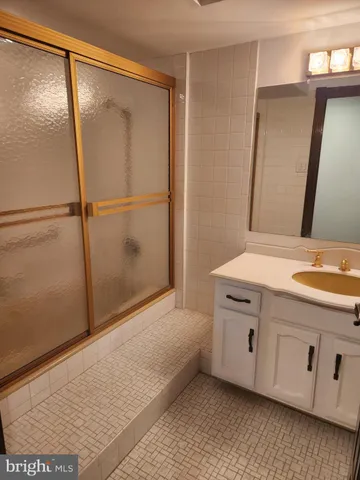 a bathroom with a double vanity sink and mirror