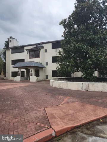 a view of a building with a yard