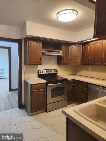 a kitchen with a stove and a sink