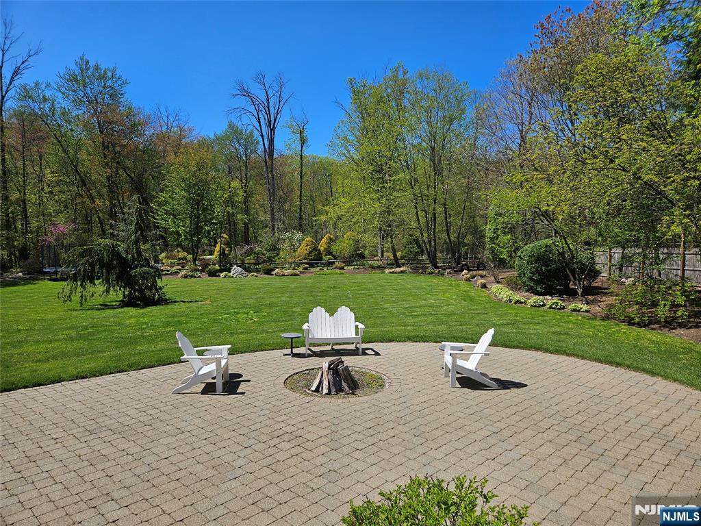 285 Chestnut Ridge Road Woodcliff Lake, NJ 07677 - Photo 11 of 46 a view of a lake with chairs and garden