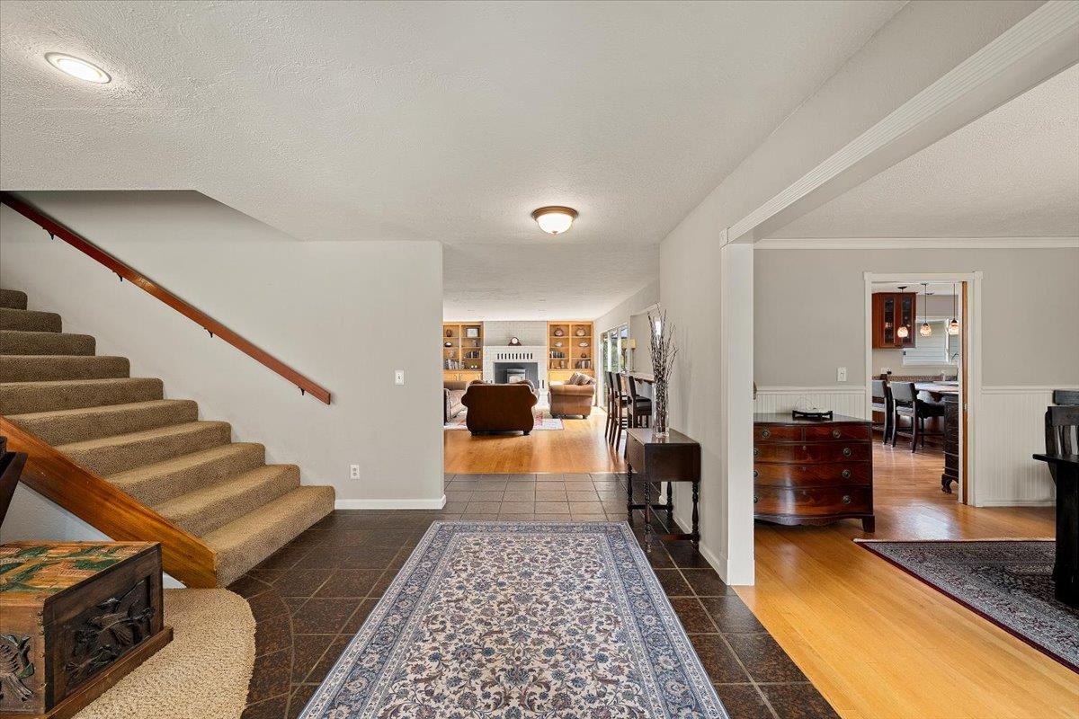 2540 Muir Court Cool, CA 95614 - Photo 12 of 97 entryway with a textured ceiling, stairs, a fireplace.