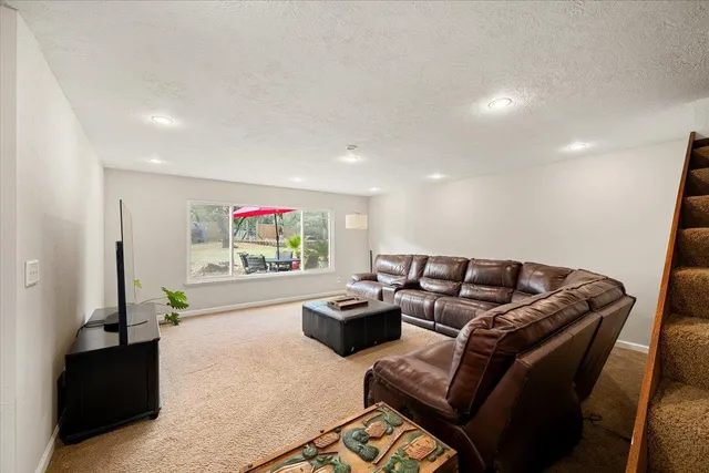 a kitchen with granite countertop a stove top oven cabinetry a sink and dishwasher