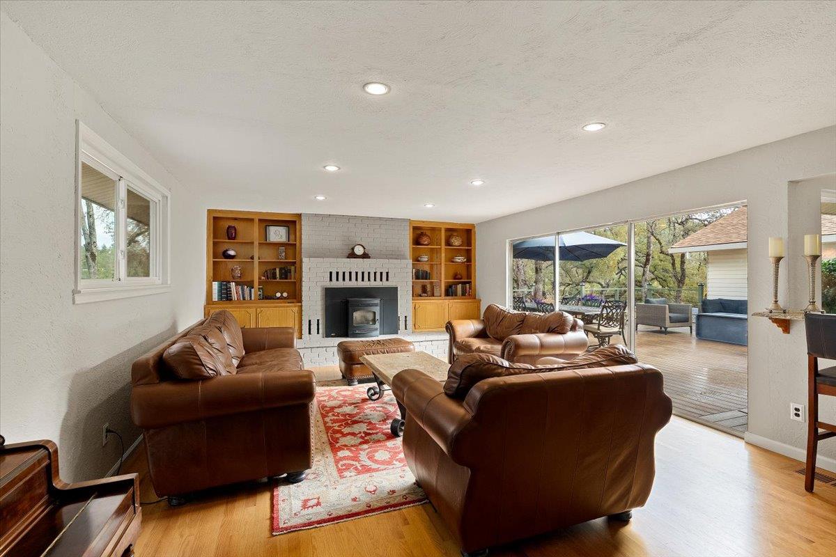 2540 Muir Court Cool, CA 95614 - Photo 19 of 97 living area featuring built in shelves, light wood finished floors, recessed lighting, and a textured ceiling