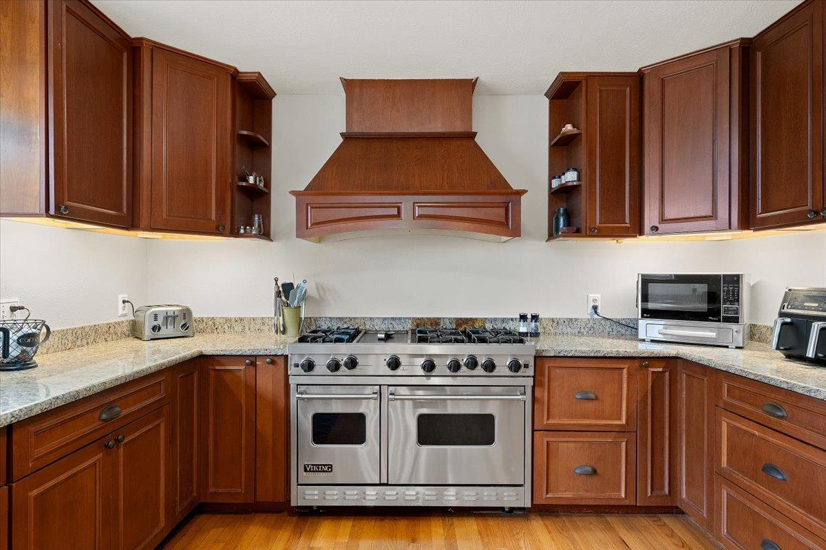 2540 Muir Court Cool, CA 95614 - Photo 24 of 97 a kitchen with granite countertop a stove top oven cabinetry a sink and dishwasher