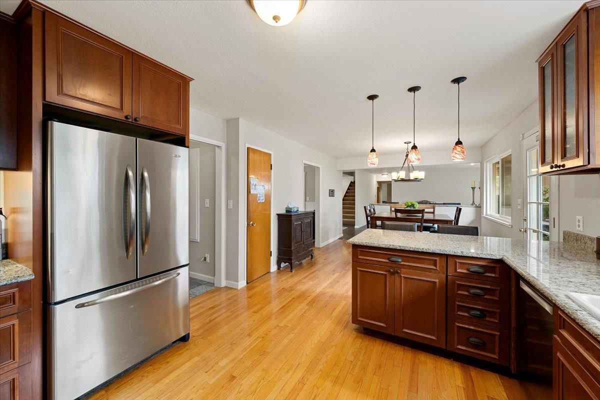 2540 Muir Court Cool, CA 95614 - Photo 25 of 97 a kitchen with stainless steel appliances granite countertop a refrigerator a stove a sink dishwasher and a refrigerator with wooden floor