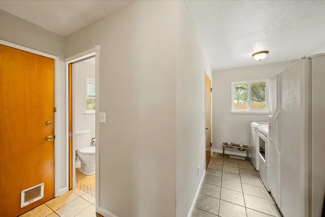 a bedroom with furniture and a window