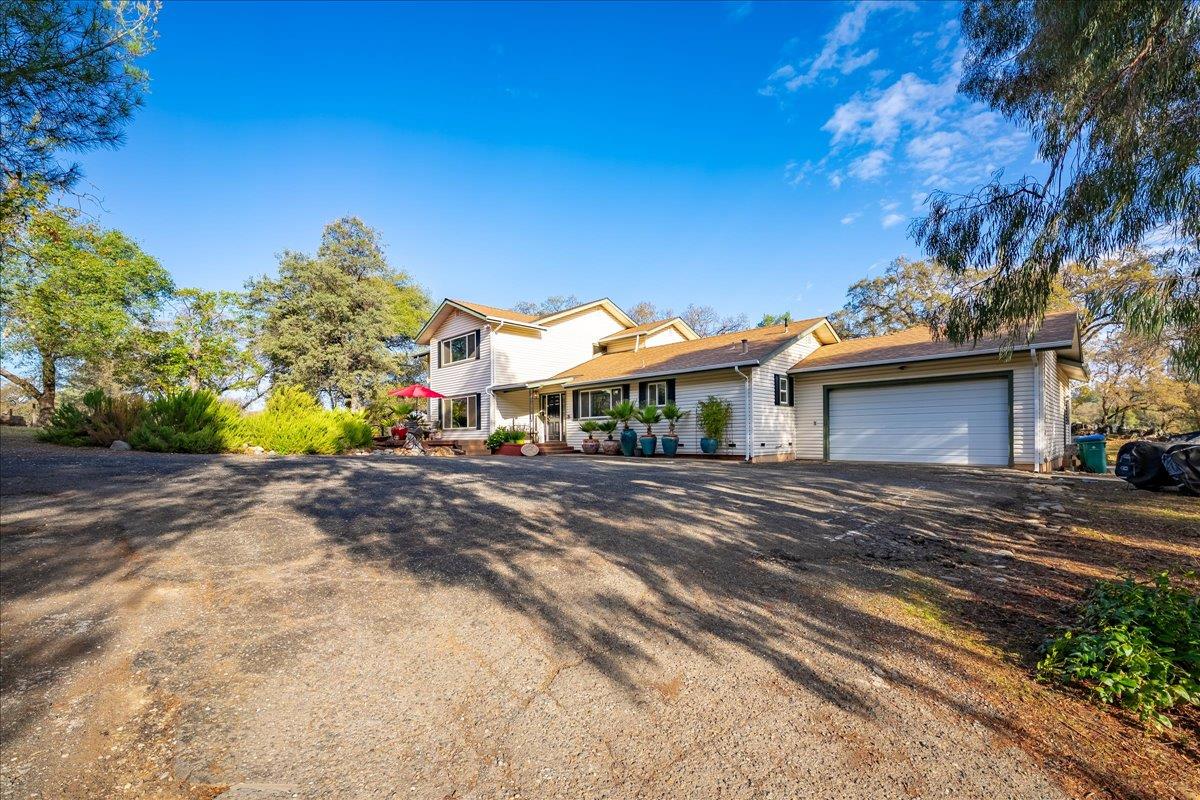 2540 Muir Court Cool, CA 95614 - Photo 3 of 97 a front view of a house with a yard and garage