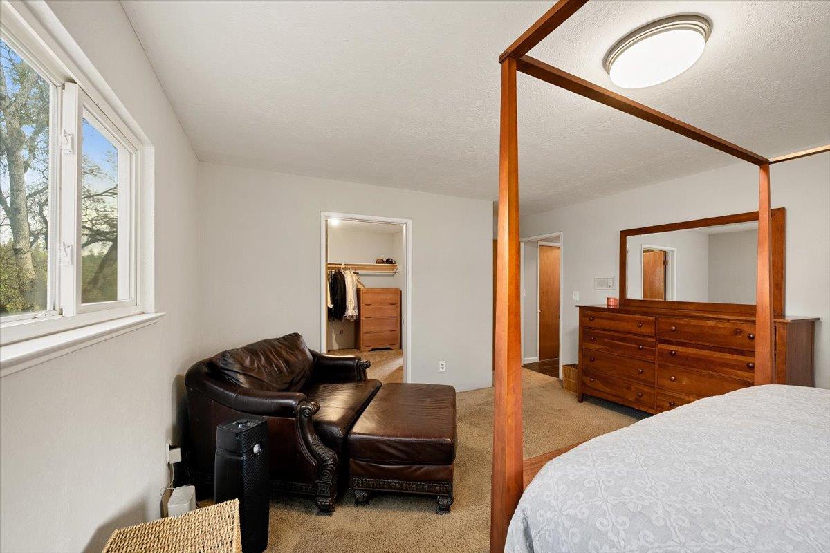 2540 Muir Court Cool, CA 95614 - Photo 33 of 97 a bedroom with a bed and wooden floor