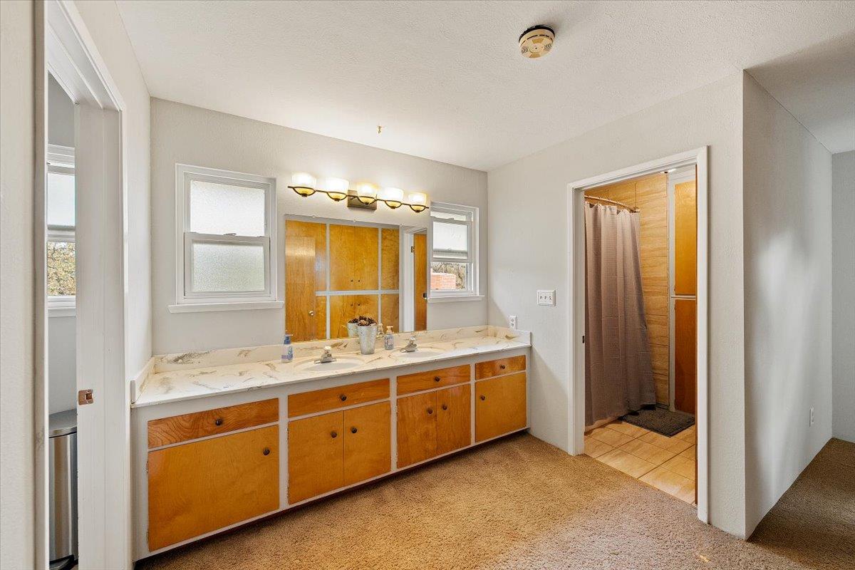 2540 Muir Court Cool, CA 95614 - Photo 37 of 97 a spacious bathroom with a double vanity sink and a mirror
