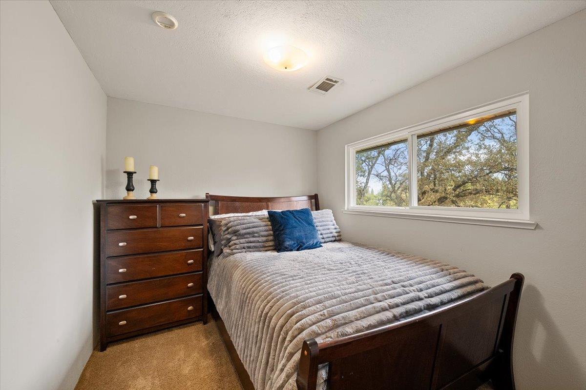 2540 Muir Court Cool, CA 95614 - Photo 39 of 97 a bedroom with a bed and a window