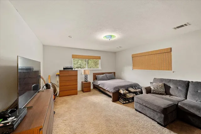 a view of a house with pool and a yard