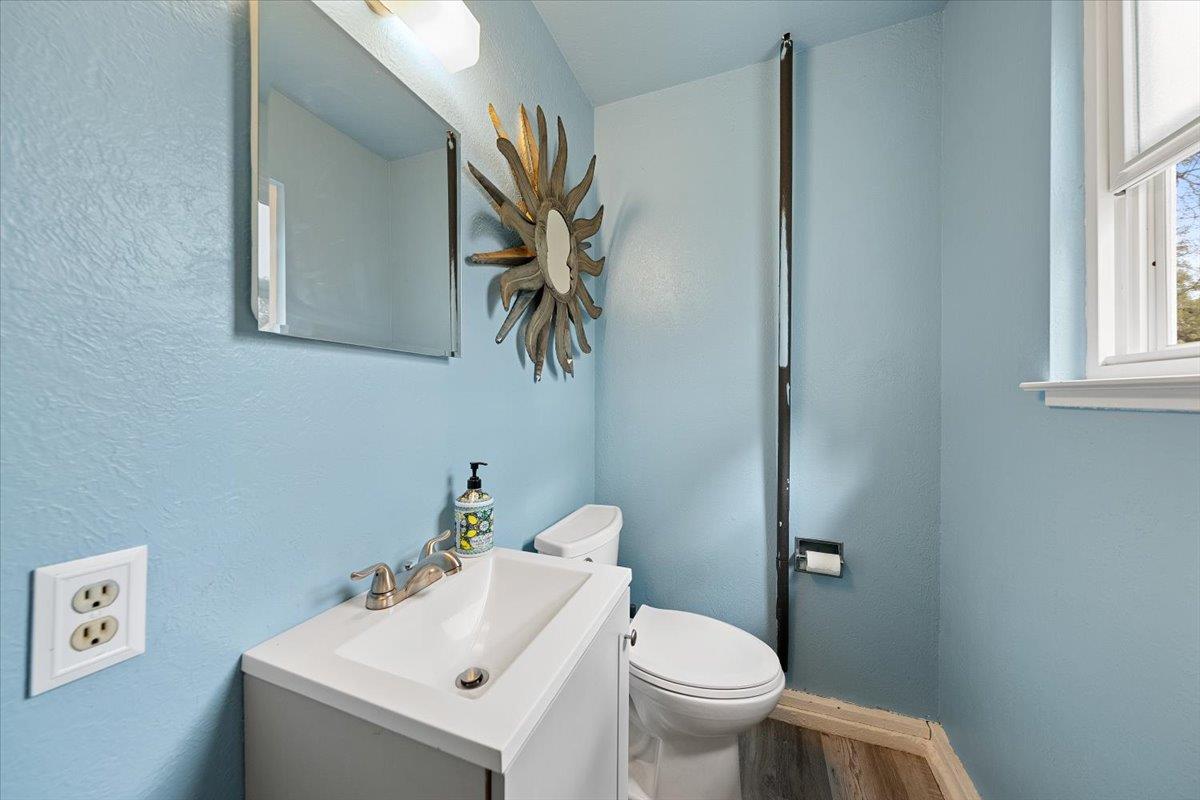 2540 Muir Court Cool, CA 95614 - Photo 45 of 97 a bathroom with a sink mirror and toilet
