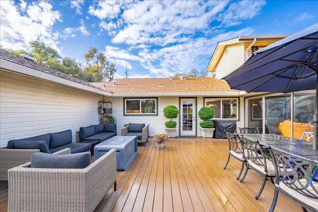 an aerial view of a house with a yard and trees