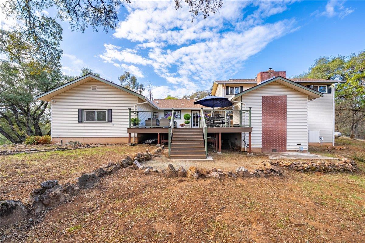 2540 Muir Court Cool, CA 95614 - Photo 53 of 97 a front view of a house with a yard outdoor seating and garage