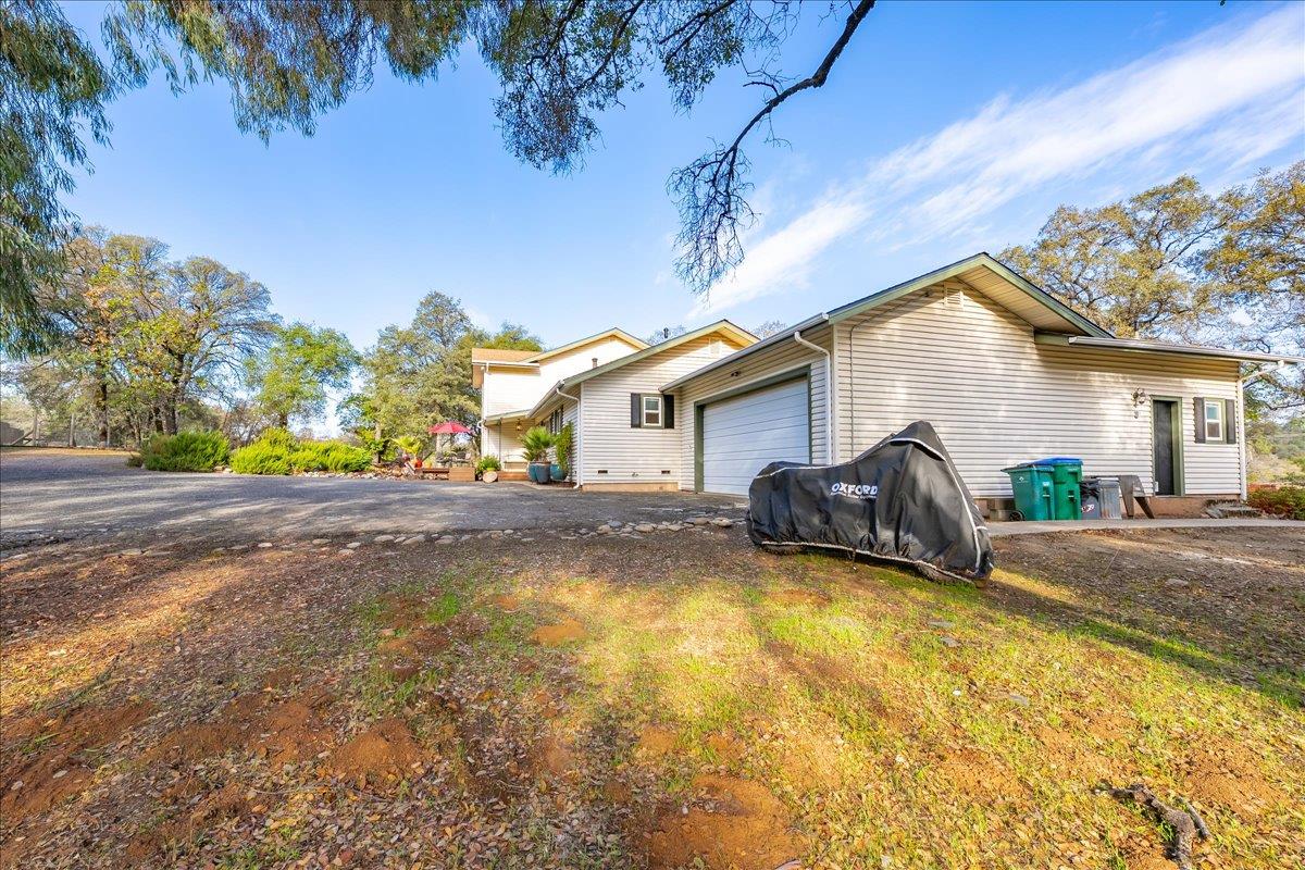 2540 Muir Court Cool, CA 95614 - Photo 57 of 97 a view of a house with pool and a yard