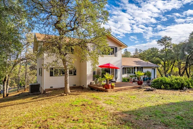 a view of a chair and tables in the patio