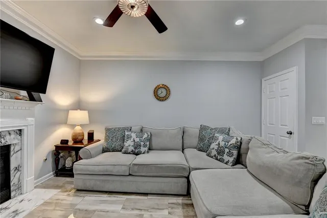a living room with furniture and kitchen view