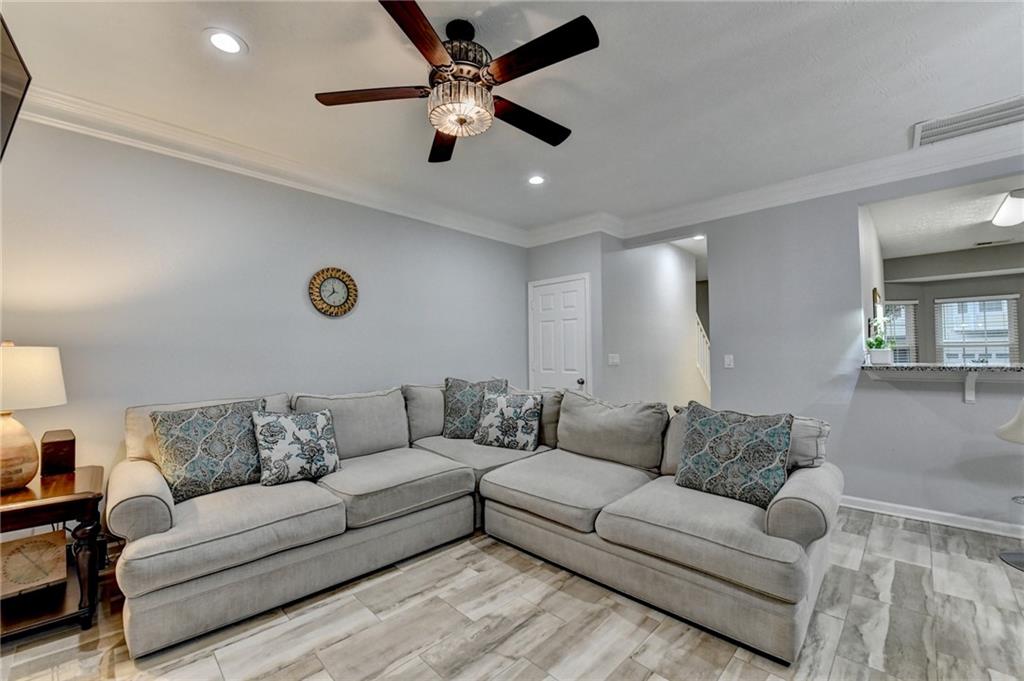 2066 Pinnacle Pointe Drive Norcross, GA 30071 - Photo 18 of 56 a living room with furniture and a ceiling fan