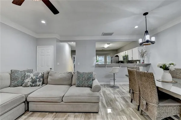 a dining room with furniture and window
