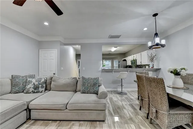 a dining room with furniture and window
