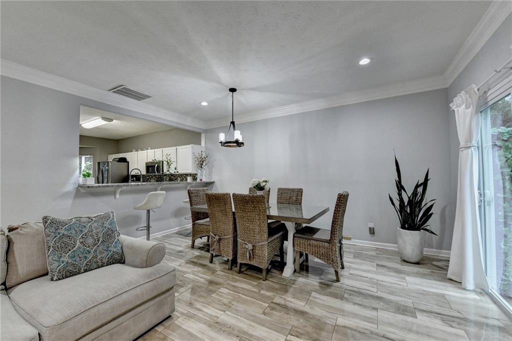 2066 Pinnacle Pointe Drive Norcross, GA 30071 - Photo 20 of 56 a living room with furniture and wooden floor