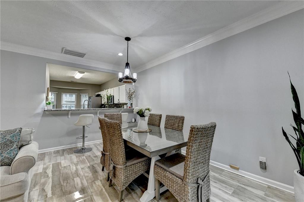 2066 Pinnacle Pointe Drive Norcross, GA 30071 - Photo 22 of 56 a view of a dining room with furniture