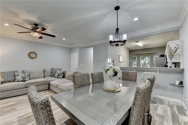 a kitchen with a table and chairs in it