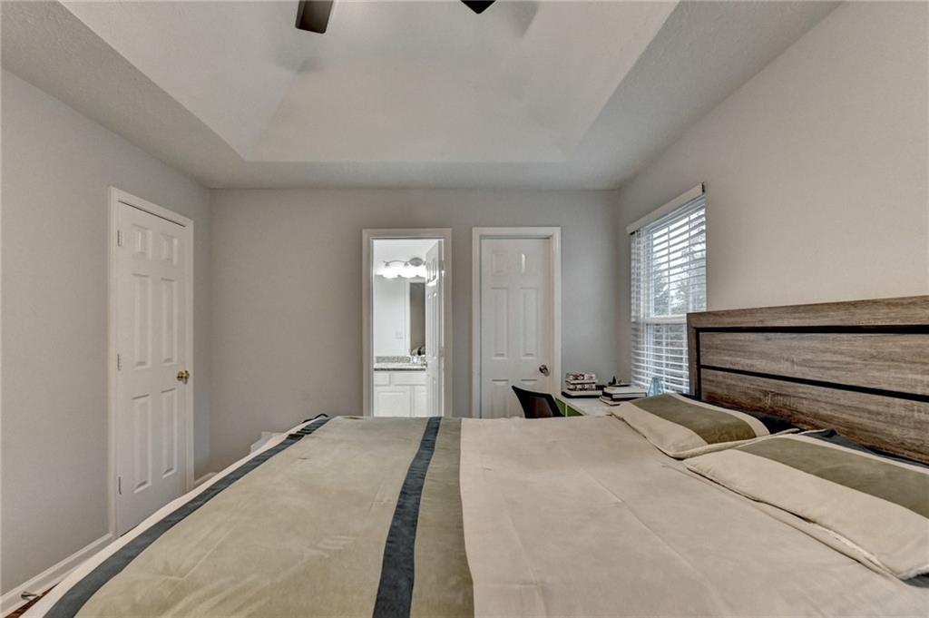 2066 Pinnacle Pointe Drive Norcross, GA 30071 - Photo 32 of 56 a bedroom with a bed and a window